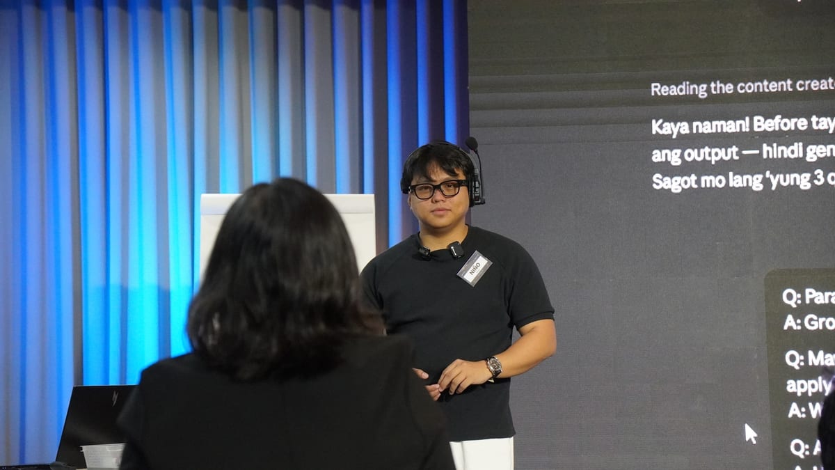 Nino coaching in headset at AI hackathon